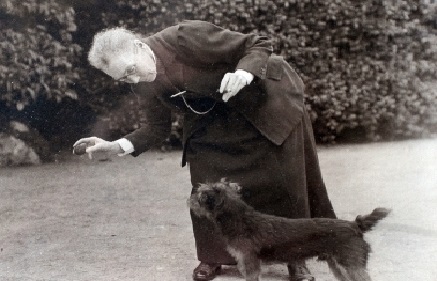 Amy Dillwyn playing with a dog 
