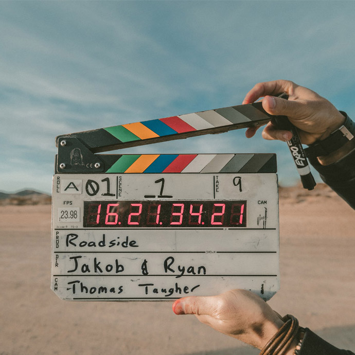 A director holding a clapperboard
