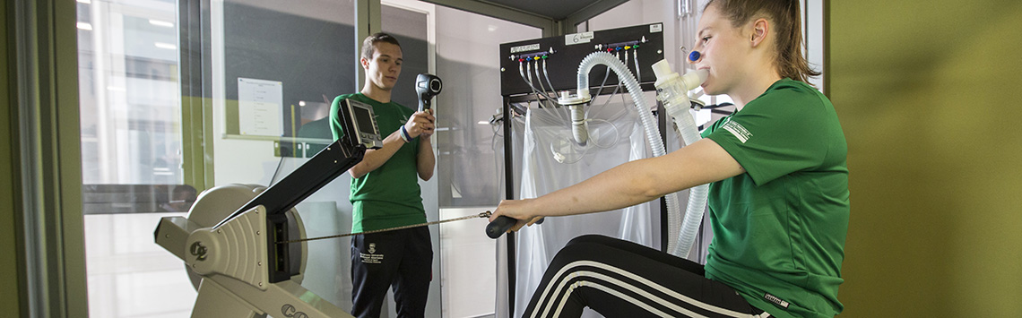 Two students using exercise testing equipment