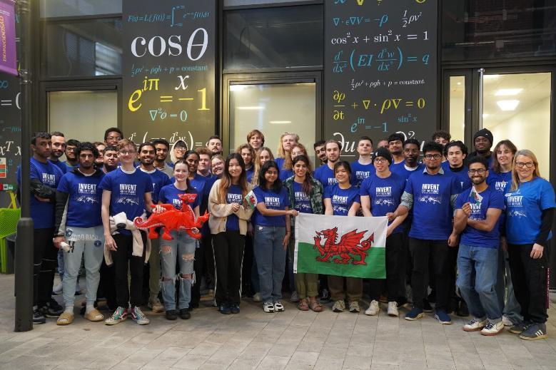 Students with Welsh flag at an engineering event