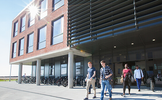 School of Management building, Bay Campus with students walking through the doors