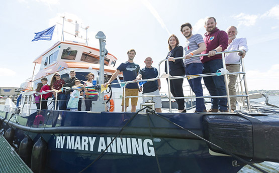 Game of Thrones star, Iwan Rheon, with Swansea University staff on the RV Mary Anning at the Urdd Eisteddfod in Cardiff Bay