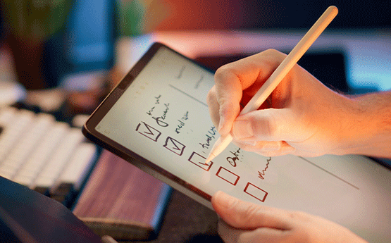 A person ticking items of a checklist.