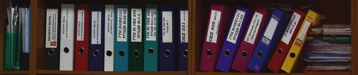 A row of folders on a shelf