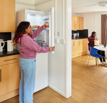 An image of two students in a shared kitchen in Beck House accommodation.