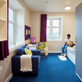An image of a student in their accommodation on Bay Campus.