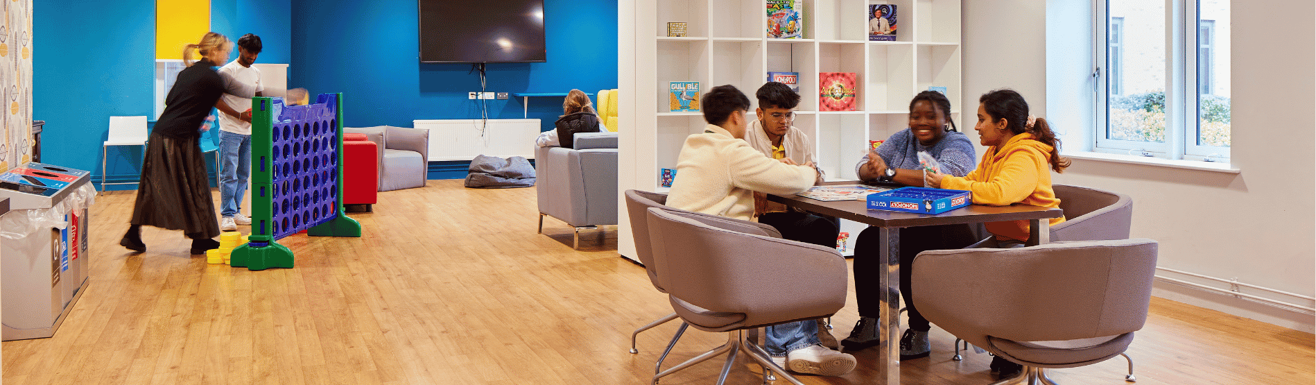 A group of students socialising in communal space in student accommodation on Bay Campus.