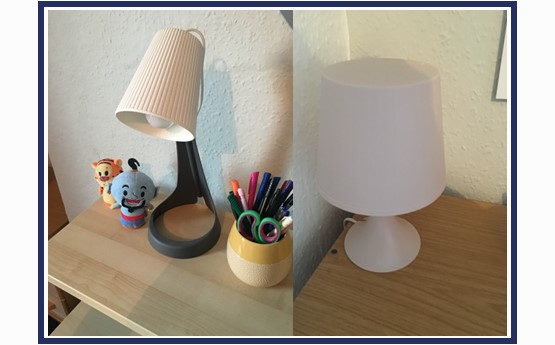 a bedside lamp, a white table lamp 