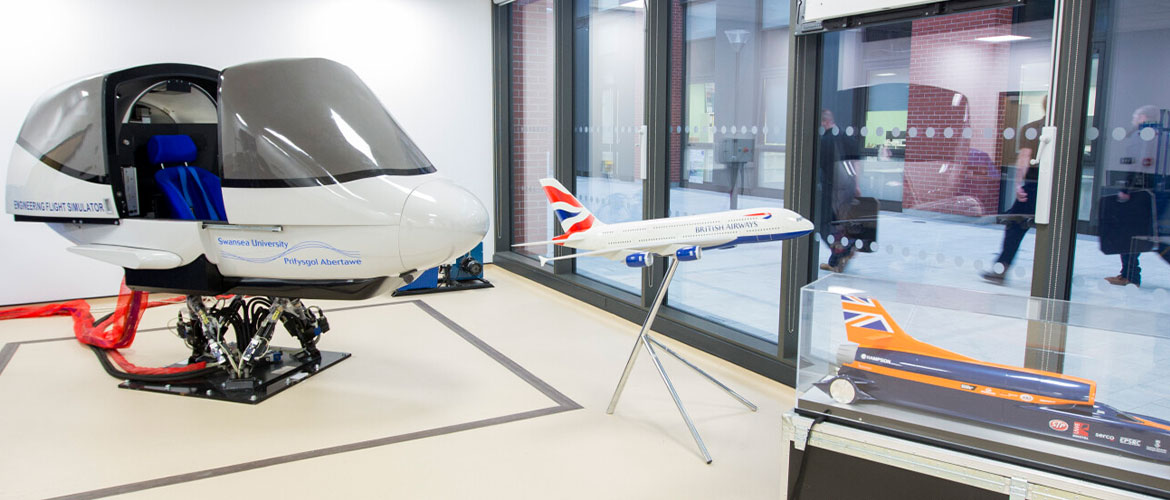 Aerospace student using equipment within the Flight Sim lab