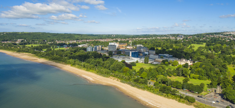 ariel shot of Swansea university singleton campus from the beach
