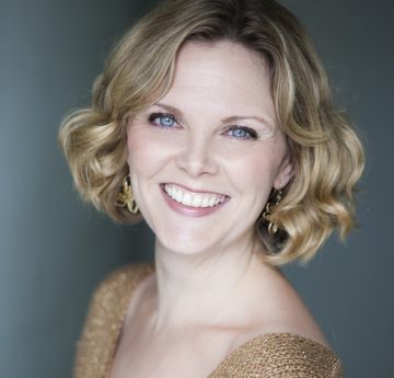 Lady in a sparkly dress smiling at the camera