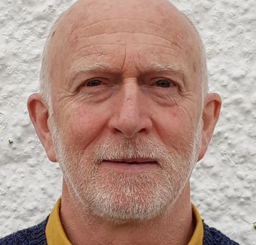 Headshot of a man looking at the camera