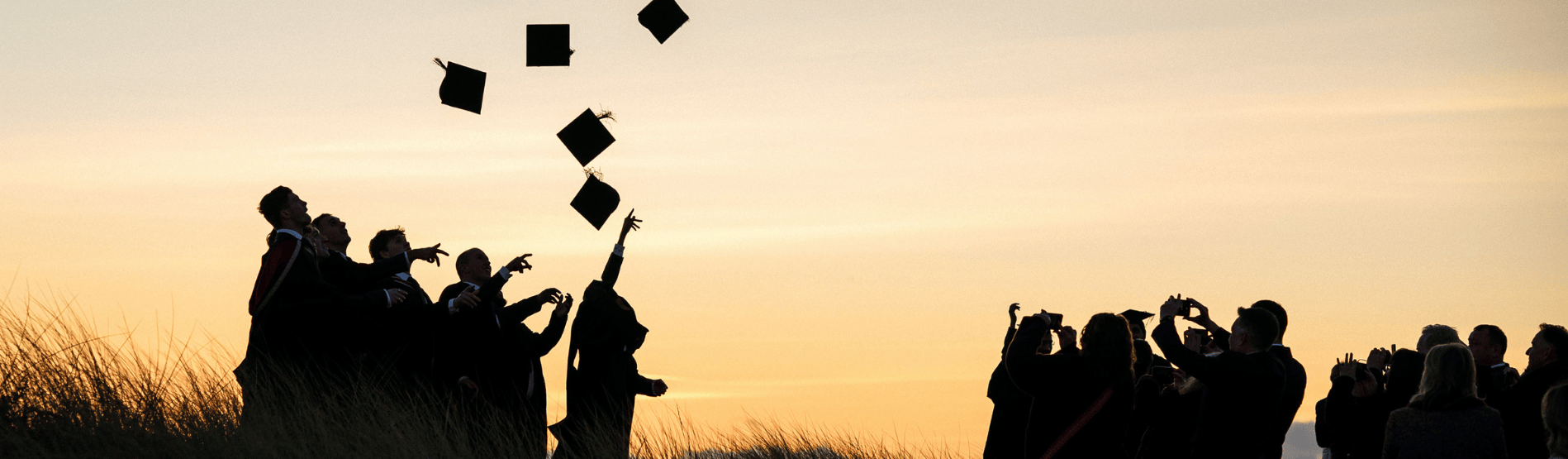 Students on the beach at graduation