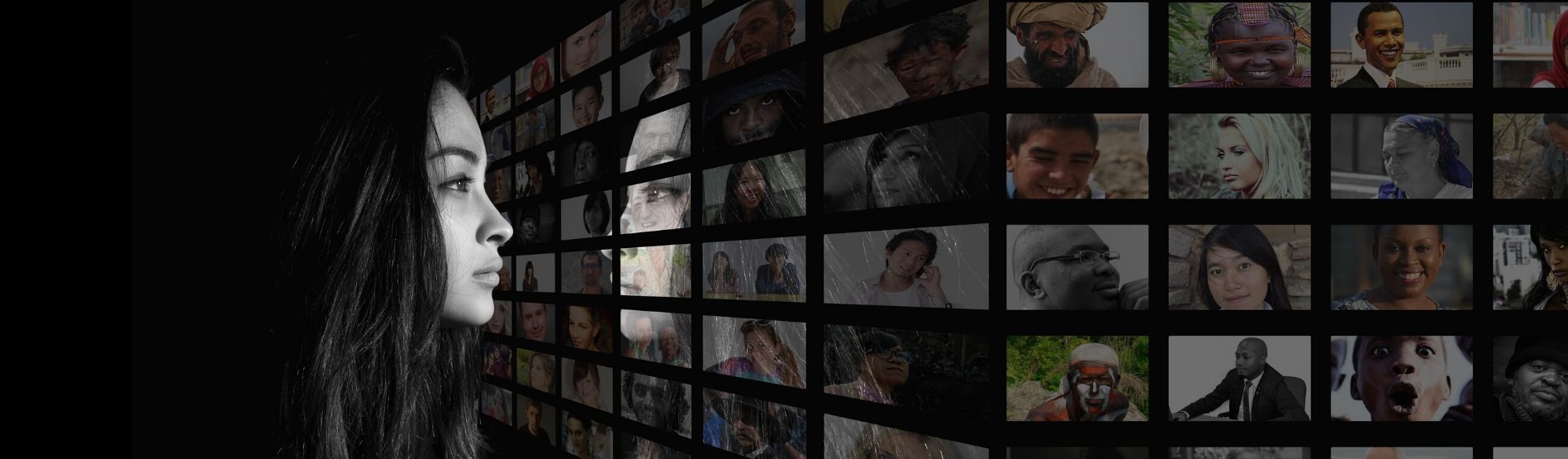 woman looking at multiple images of people on a black wall