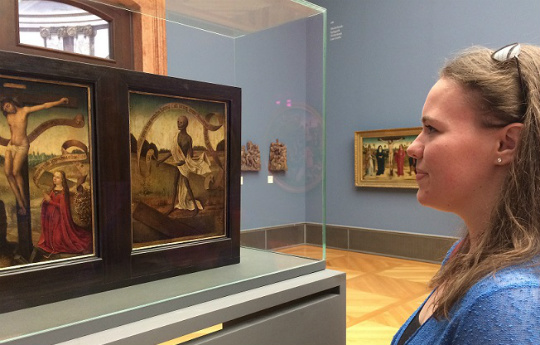 A woman viewing art in a museum