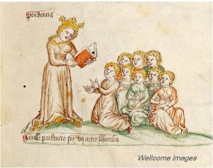 A medieval depiction of a woman reading to children