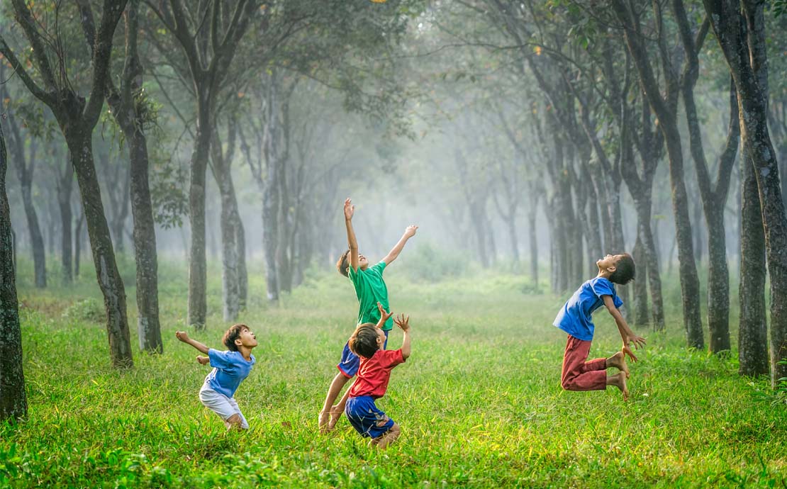 Image of children playing in the forest