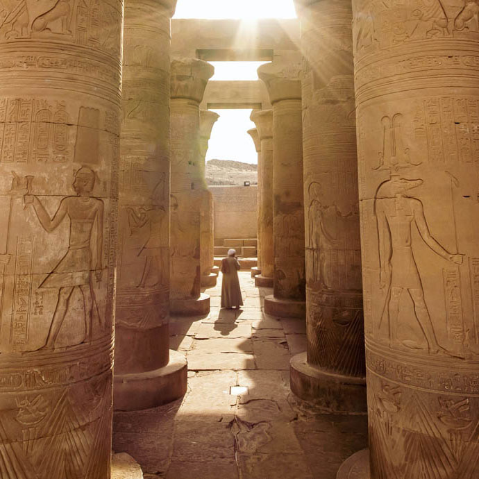Image of the Egyptian Columns and a person in a middle