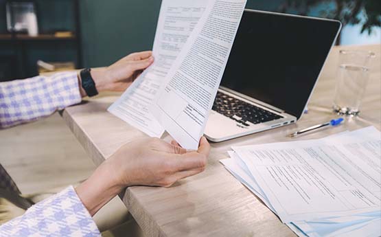 A person reading though notes