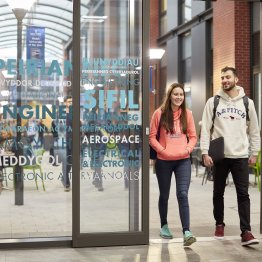 students walking through engineering central entrance