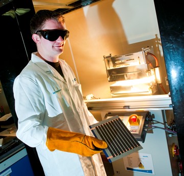 Ian Mabbett in a lab wearing protective clothing
