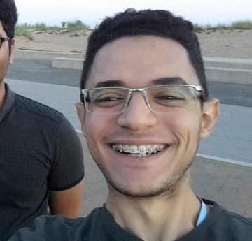 Ahmed Ibrahim taking a selfie on the beach 