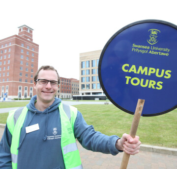 volunteer giving a campus tour