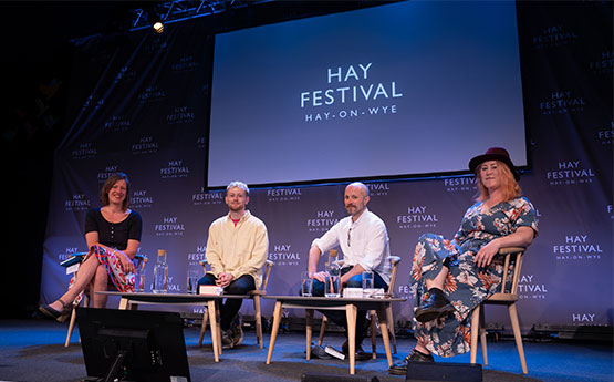 Kirsti Bohata, Dylan Huw, David Llewellyn and Crystal Jeans seated onstage at the Hay Festiavl