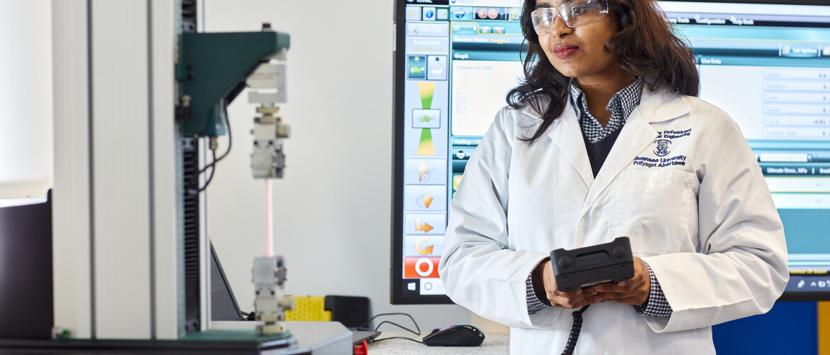 Biomedical student doing a tensile text in the lab