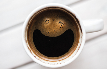 Coffee froth in a smiley face