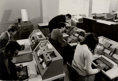 people using old typewriters