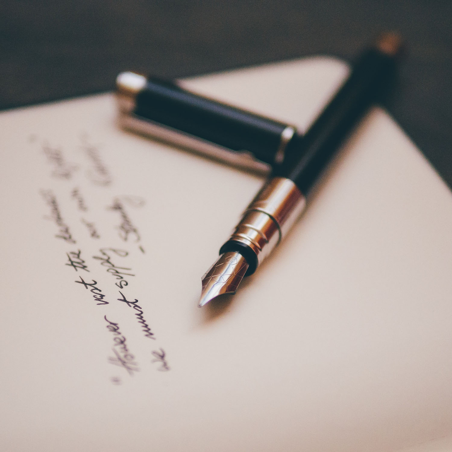 Image of a fountain pen and paper
