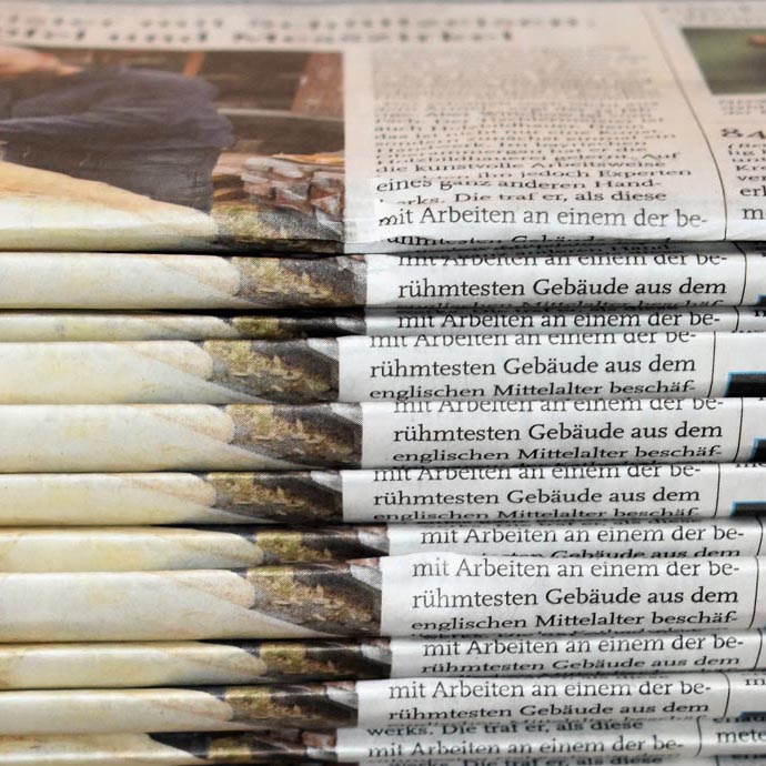 Image of newspapers stacked together