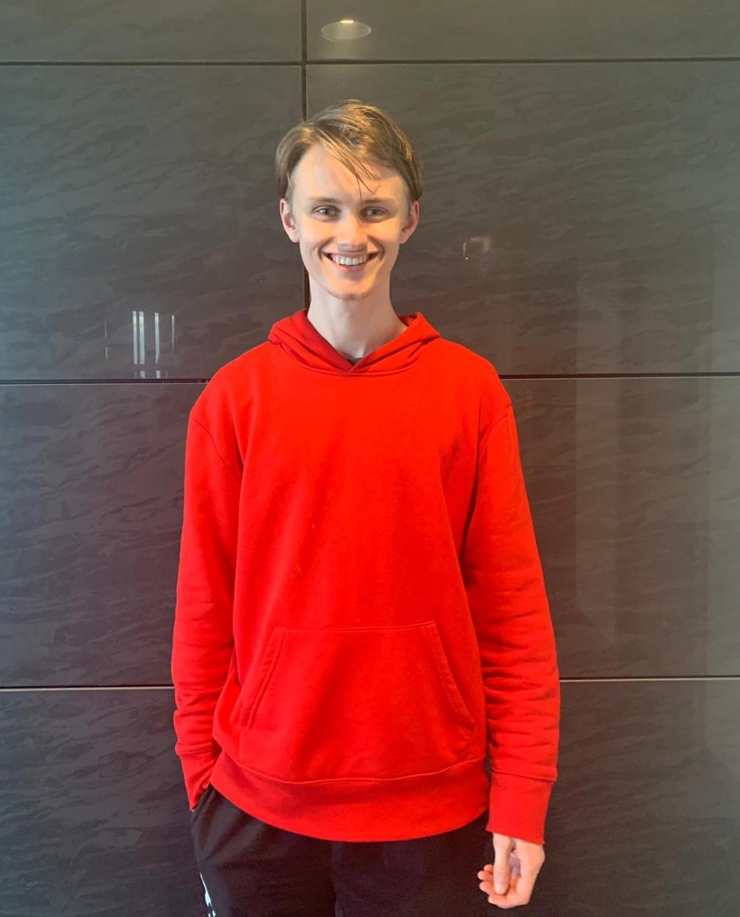 a student in a red hoody