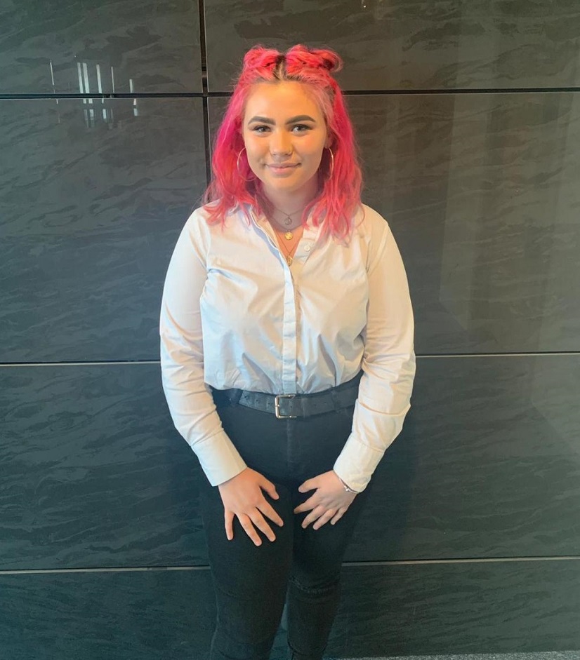 female student with pink hair