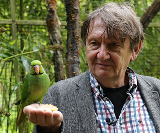 carl jones holding a bird