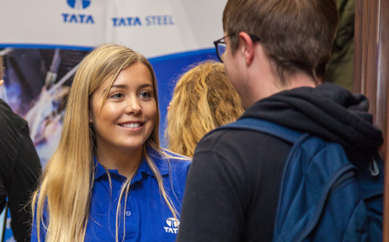 Lady from Tata Steel talking to a male student