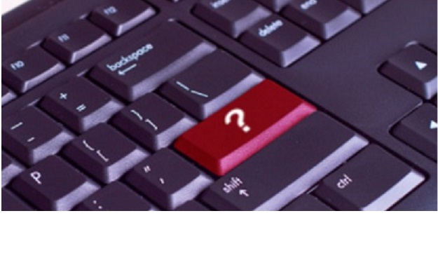 a computer keyboard with one key highlighted in red with a question mark