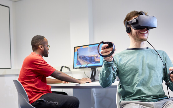 Computer science students with VR headset
