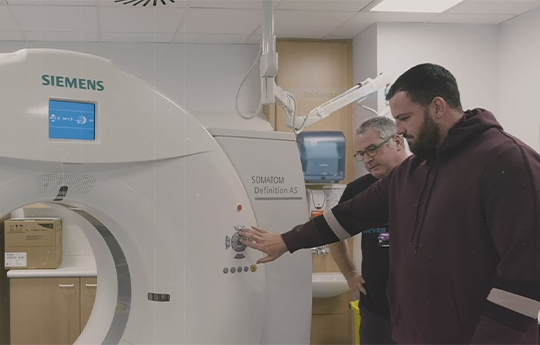 Students using an MRI machine 