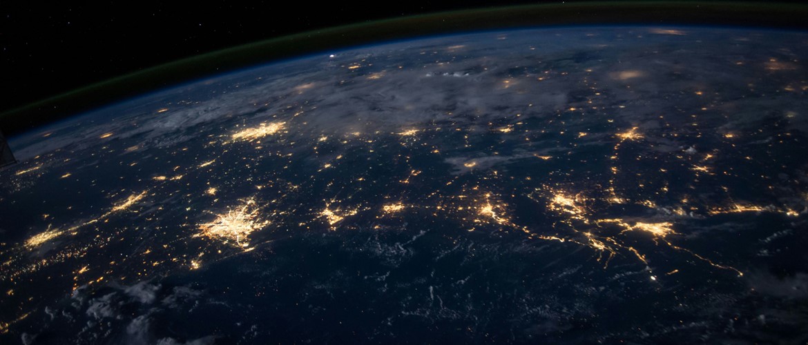 space view of earth and lit cities