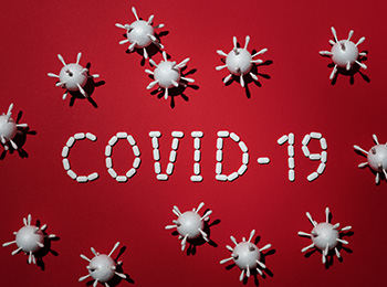Covid word on red background