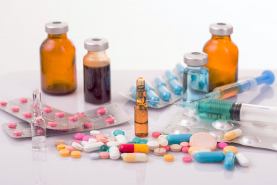 range of different drugs in plain labelled bottles, vials and syringes