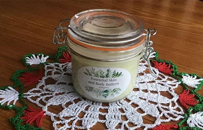 Glass jar containing body butter from Essential Skin and Body Butters