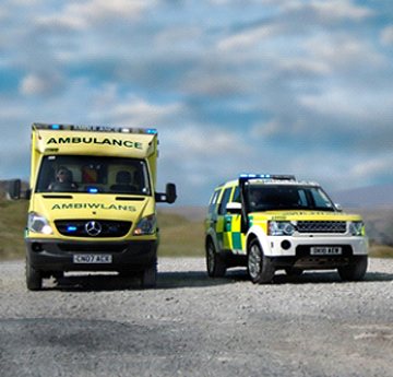 Ambulances with mountains in the background