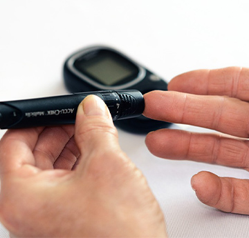 Blood glucose monitor being used