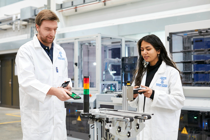 Male and female student in festo cyber security lab