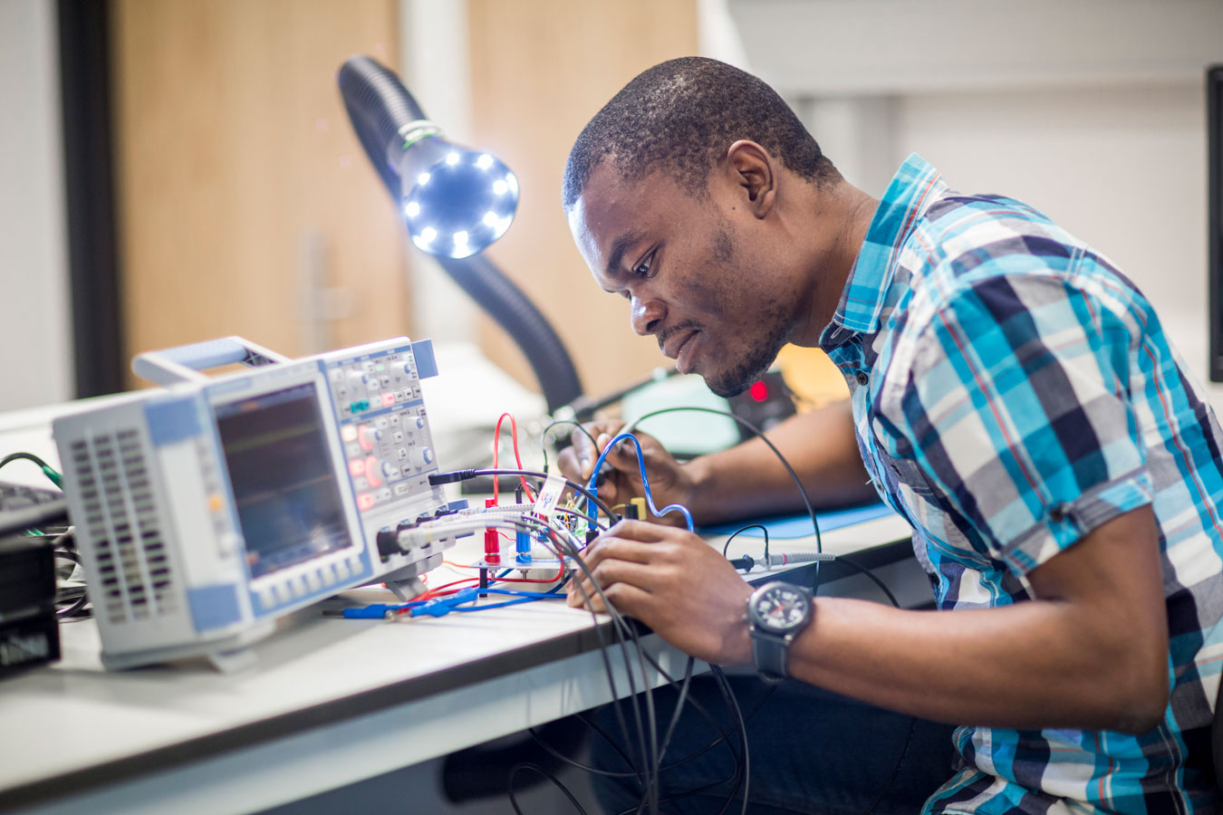 Male student in electronics lab