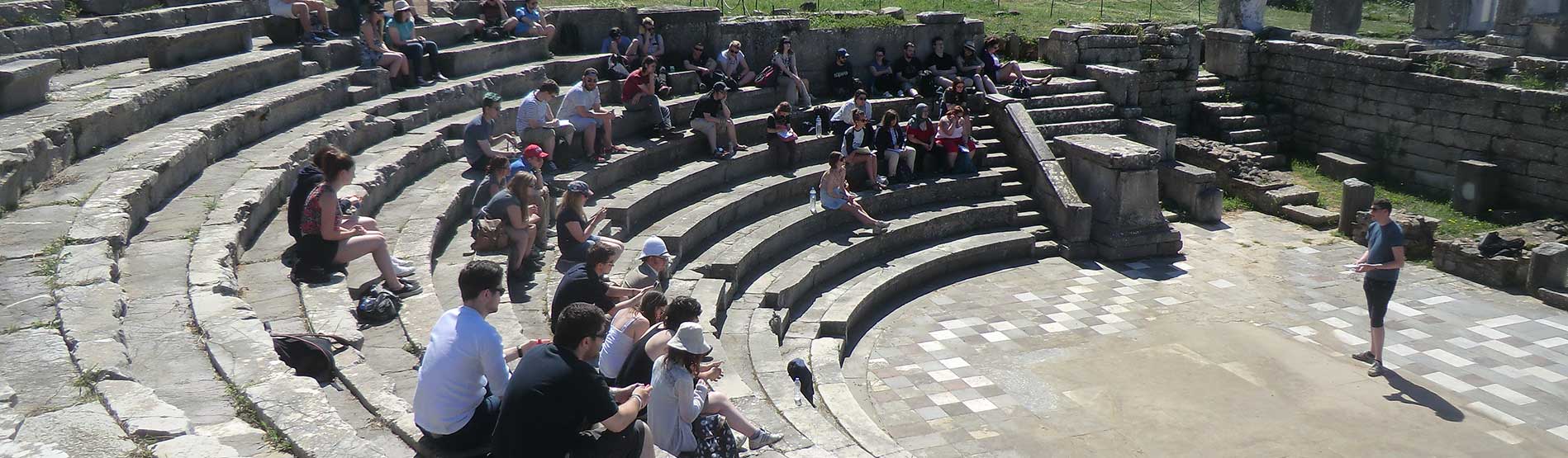 An image of people sitting in an amphitheater
