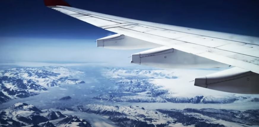 View from a plane flying over glaciers